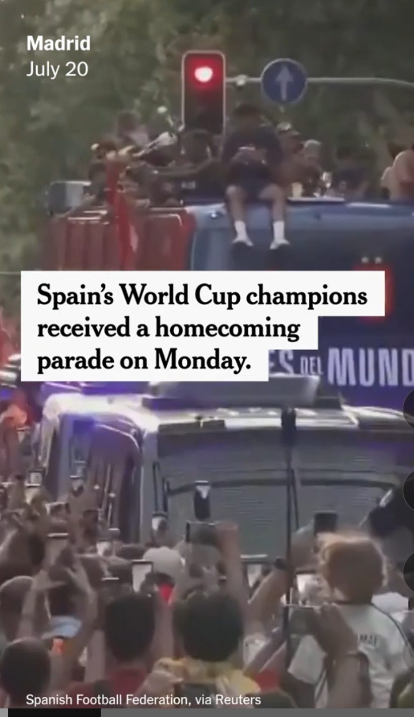 Spain players on an open-top bus during the homecoming parade in Madrid
